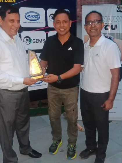 Presenting a memento to a chief guest, acknowledging their support for our inter-school squash initiatives.