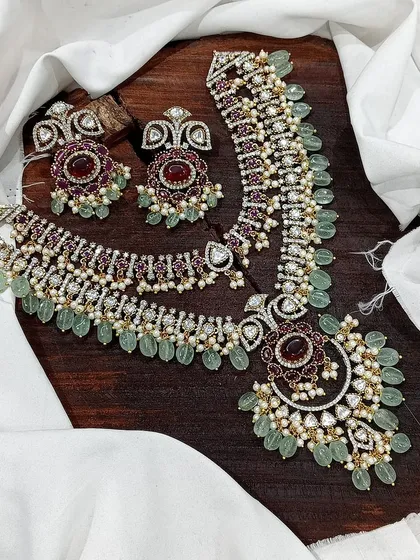 A ruby-red version of the same layered necklace design.