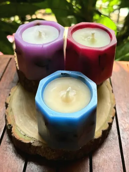 A trio of our small shell candles in vibrant purple, pink, and blue. These are perfect for adding a pop of color and fragrance to any space and make for wonderful, reusable gifts.