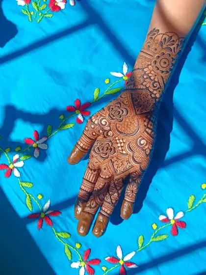 A progress shot of a semi-bridal henna, showing the beautiful details taking shape.