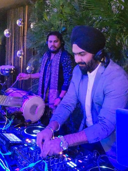 In the zone with my percussionist, mixing beats while he lays down the rhythm. This synergy is what makes our live fusion sets so powerful.