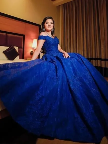 Something blue. This client chose a vibrant royal blue ball gown for her event, and I created a classic glam look to match.