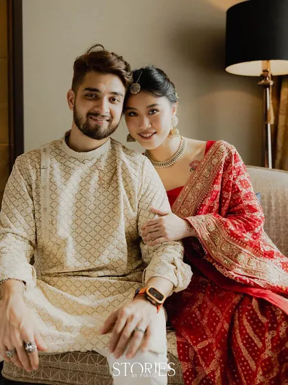 A relaxed and intimate portrait of Nick and Carrie seated together. This image captures their comfortable and warm connection, making them feel both aspirational and relatable.