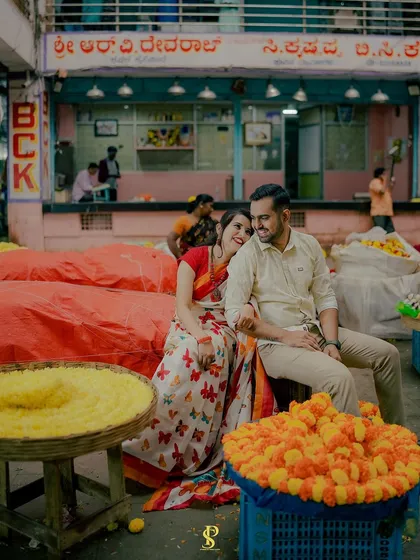 A candid moment shared between the couple at a flower stall in KR Market. Even in a busy public space, I focus on creating a private world for you, capturing the smiles and glances that are just for each other.