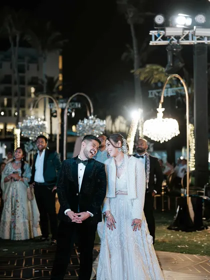 A candid moment of laughter between the couple during their reception. Even in the midst of a big party, it’s these small, shared moments that are the most precious.