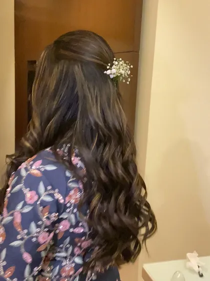 Another angle of the soft curls and baby's breath hairstyle. It's a versatile look that works beautifully for engagements, receptions, or as a guest.