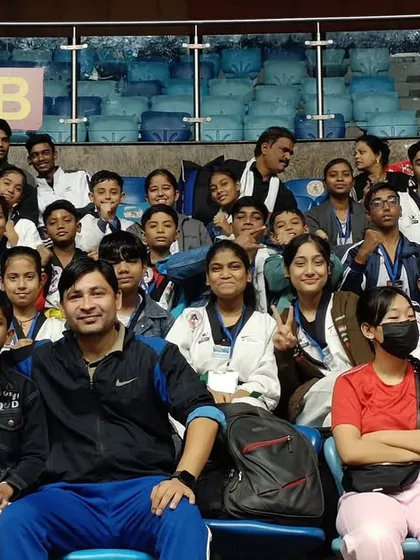 A candid moment with the team in the stands during the championship.