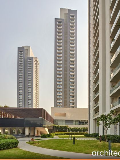 The 30-storey towers of EMAAR Digital Homes are set back from the central clubhouse, creating a large, open green lawn. This space acts as a community park, offering a picturesque landscape journey and an immersive outdoor experience.