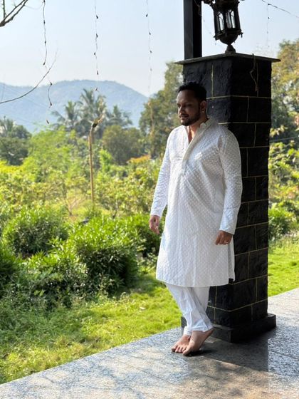 Our classic white chikankari kurta is perfect for a puja, a festive occasion, or a relaxed family event. It's a comfortable and elegant rental choice.
