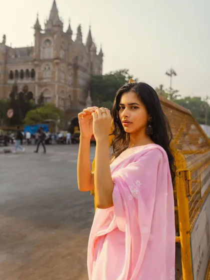 A candid, interactive pose in front of CSMT. This shot feels natural and unforced, capturing a genuine moment.
