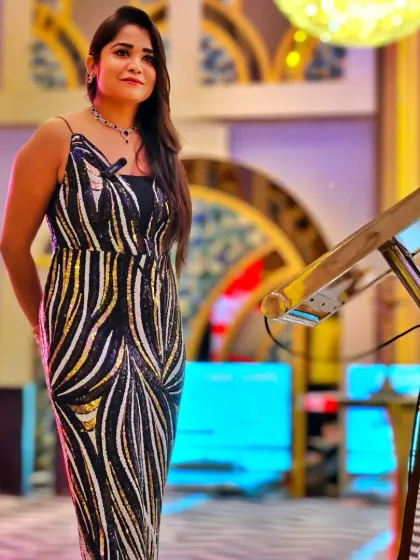 A full-length view of my elegant look for the RP Group's gala evening. I transition seamlessly from the formal business meet to the celebratory dinner.