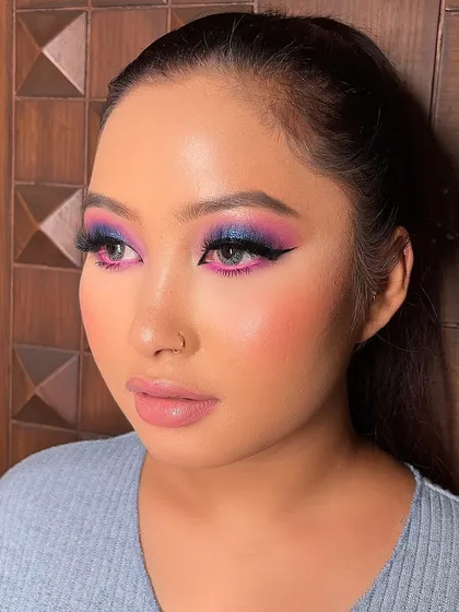 A creative look with pink and blue tones and a sharp winged liner. Perfect for someone who loves a pop of color.