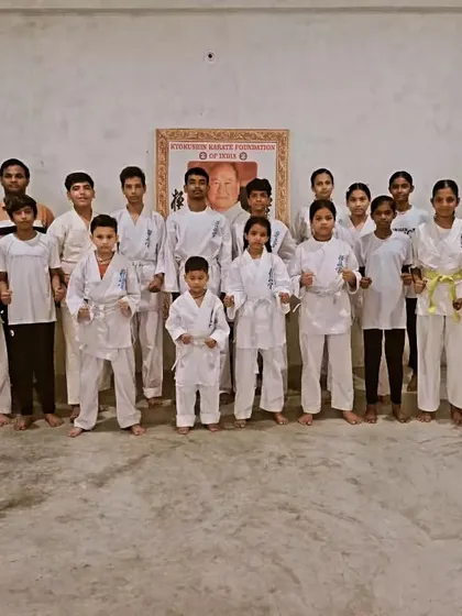 A group photo of my students after a tough training session. They are tired but proud.