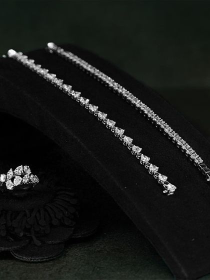 Feel the beauty of understated luxury with the minimal design and maximum sparkle of these diamond tennis bracelets and matching ring.