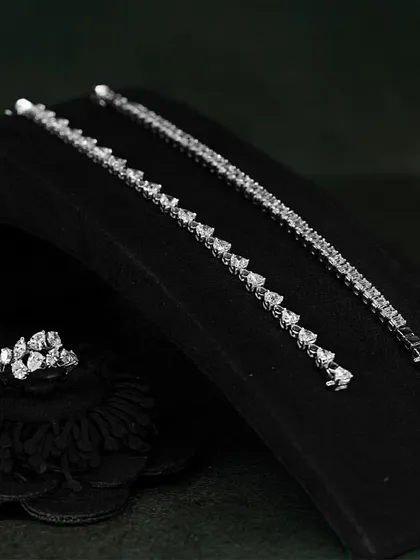 Feel the beauty of understated luxury with the minimal design and maximum sparkle of these diamond tennis bracelets and matching ring.