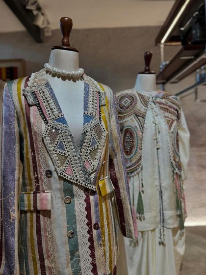 A stunning multi-colored striped blazer with a heavily embellished lapel, a standout piece from Aseem Kapoor's 'Mural' collection.