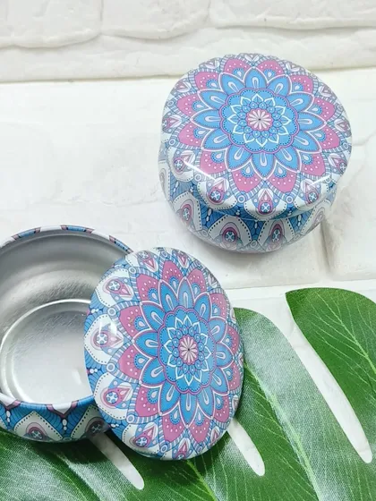 This pink and blue mandala-printed tin box is a vibrant and eye-catching packaging choice.