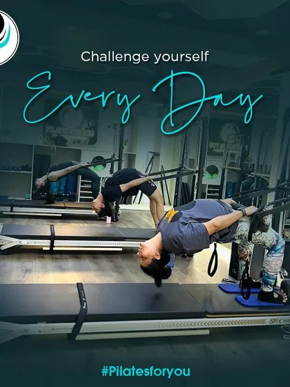 Challenge yourself every day. This advanced hanging exercise on the Cadillac requires immense core and upper body strength, demonstrating the peak of physical control.