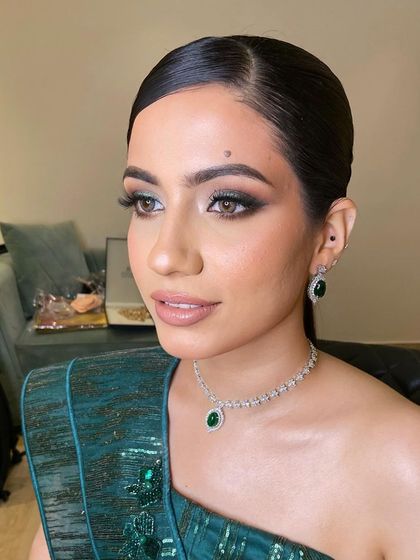 A close-up of this gorgeous green smokey eye. It's a great reminder that makeup enhances, but skin texture is real and beautiful.