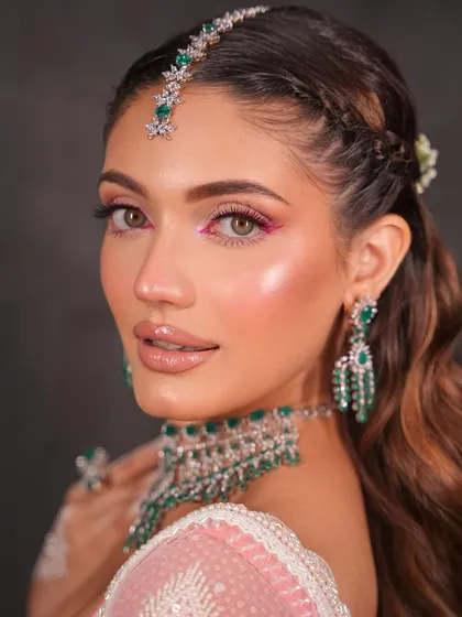 This look is all about that fresh, dewy glow, enhanced by a playful and colorful liner.