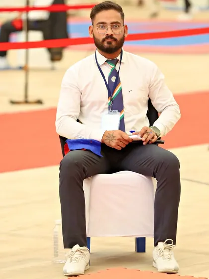 Serving as an official during a championship event. This role requires sharp focus and a deep understanding of Taekwondo rules and ethics, principles I instill in my students.