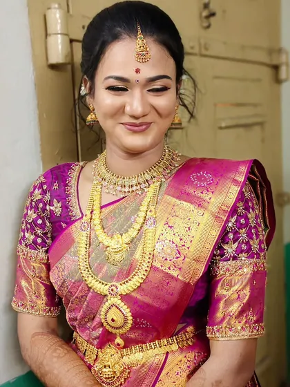 A beautiful engagement makeover with a magenta Kanjivaram saree. The makeup is kept elegant with a focus on the eyes and a matching lip shade.