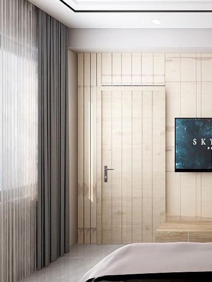 Another view of the master bedroom TV wall, showing how the door seamlessly merges with the paneling. This technique creates a clean, cohesive look and enhances the overall appearance of the wall.