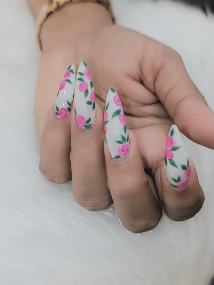 A simple, clean shot of the hand-painted rose nail art. The detail in each petal and leaf is clearly visible, showcasing the quality of my work.
