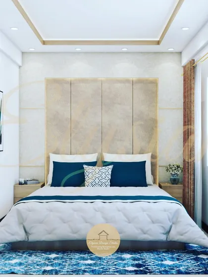 A master bedroom design with a full-height upholstered headboard against a textured wall with brass inlays, creating a simple yet luxurious focal point.