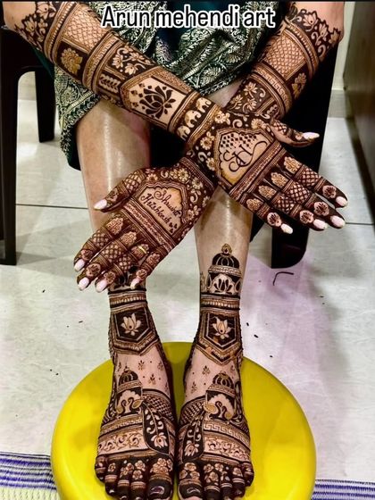 A full bridal mehendi package, showcasing intricate lotus and jharokha designs on the hands with complementary patterns on the feet.