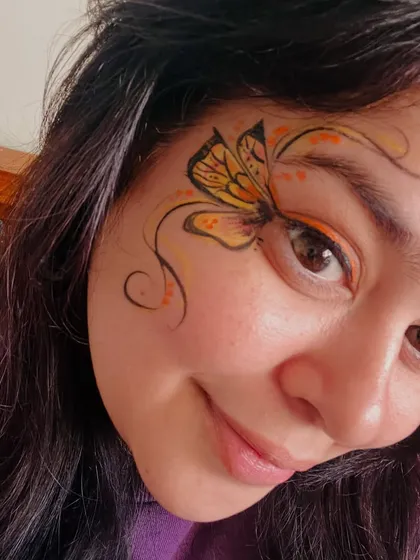 A selfie of my own work. I love creating these delicate butterfly designs with a touch of color.