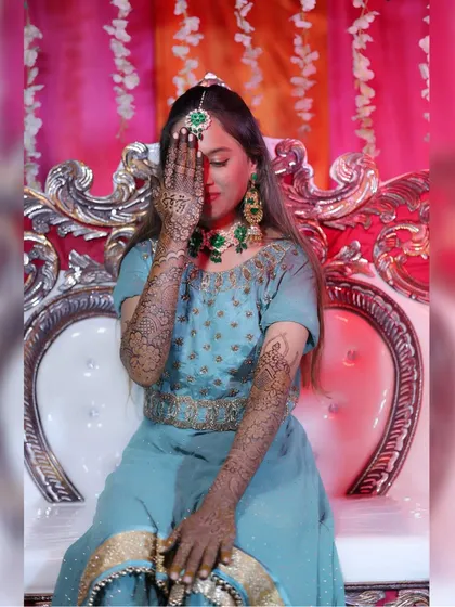 My beautiful bride Hafza, posing with her intricate bridal mehendi at her ceremony.