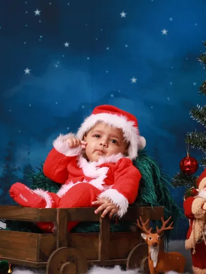 Capturing the thoughtful gaze of a baby experiencing their first Christmas theme. These sessions are about more than just a costume; they are about creating a feeling of wonder.