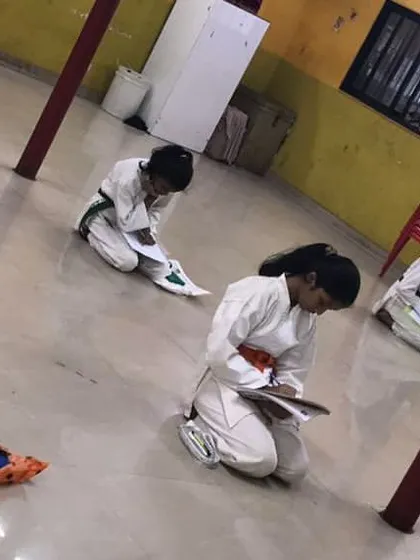 Progress in karate is not just physical. Our students are taking their theory exam, a written test that covers history, etiquette, and technique. This ensures a complete understanding of the art form.