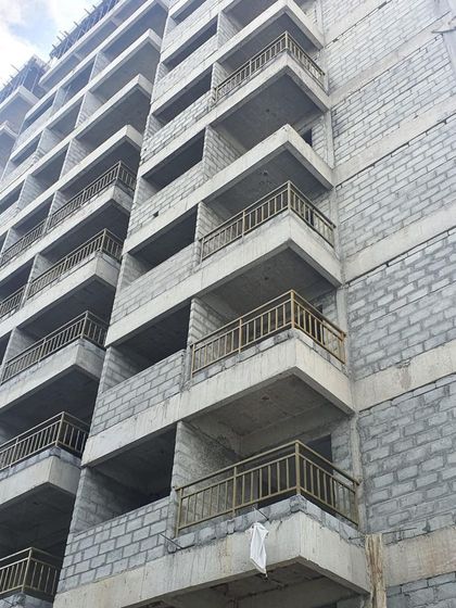 A close-up on the balconies during construction. Even at this early stage, the clean lines and repeating patterns of the architectural design are visible.