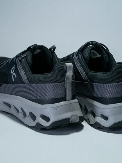 The heel view of the On Running Cloudhorizon, highlighting its unique sole technology and durable construction.