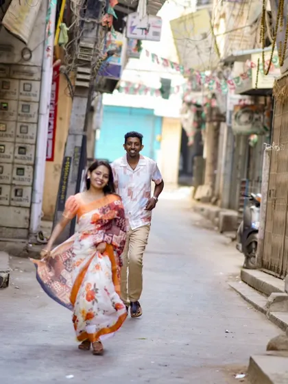 A candid and joyful moment captured in the narrow, charming streets of old Bangalore.