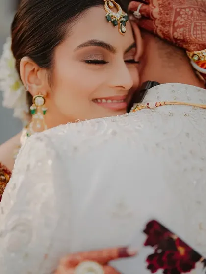 An intimate embrace. Even up close, her makeup looks like real skin, with soft sculpting and a natural finish. This is the power of a well-prepped, minimal glam.