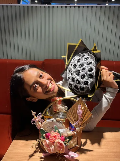 A fun shot of the birthday girl hugging her gifts. My goal is always to create hampers that bring this much joy.