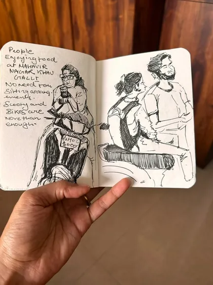 A pen and ink sketch capturing people enjoying street food in Mahavir Nagar. Sometimes a scooter is all the seating you need in Mumbai!