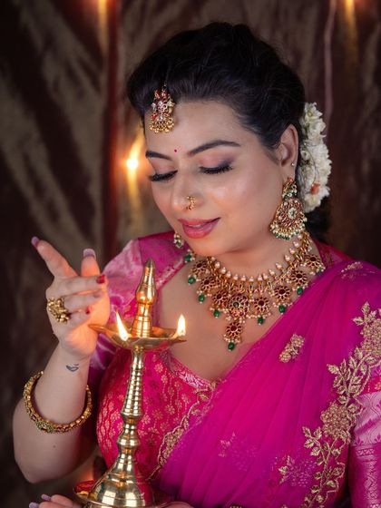 A close-up showing the detail of the eye makeup and the traditional bindi, perfectly capturing the festive spirit.