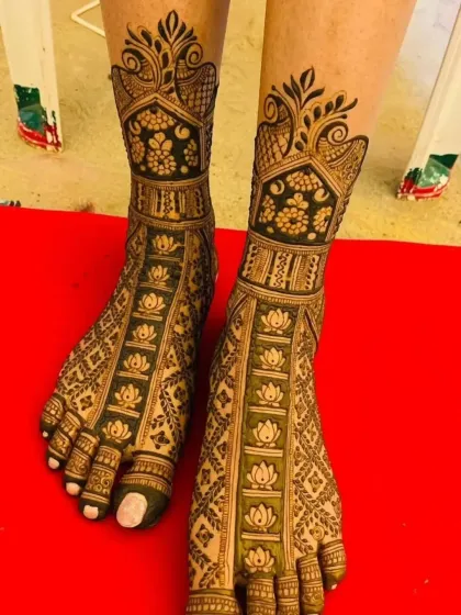 Your feet deserve just as much love. I design elegant and intricate foot mehandi, like this pattern featuring lotus bands and peacock details, to complete your bridal look.
