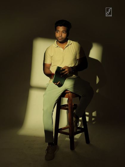 A full-body shot that shows how the shadow pattern falls across the subject and the background, creating a cohesive artistic look.