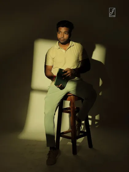 A full-body shot that shows how the shadow pattern falls across the subject and the background, creating a cohesive artistic look.