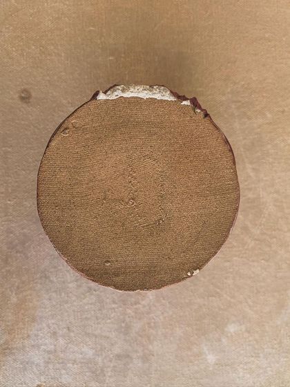 The bottom of a hand-built piece, showing the raw, unglazed clay. I love leaving this part exposed as a reminder of where the piece came from.