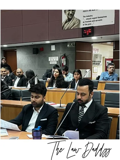 My team and I reviewing materials during the IPR conference. It's crucial for young lawyers to understand the intersection of law, technology, and creativity.