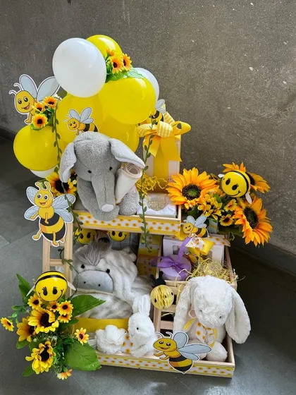 A duplicate of ID 171, this tiered bee-themed hamper is overflowing with plush toys, baby essentials, and cheerful decorations, making it a truly impressive and joyful gift.