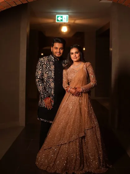 The couple looking elegant and in love during their Sangeet. We help coordinate outfits and styling to ensure a cohesive and beautiful look.