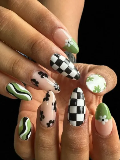 I love a challenge, and this mixed-pattern set was so much fun to create. It combines trendy checkerboard, delicate florals, and bold swirls on almond-shaped gel extensions.