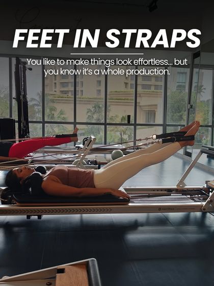 "Feet in Straps" looks effortless, but it's a whole production. This series is amazing for hamstring flexibility, hip mobility, and core engagement.